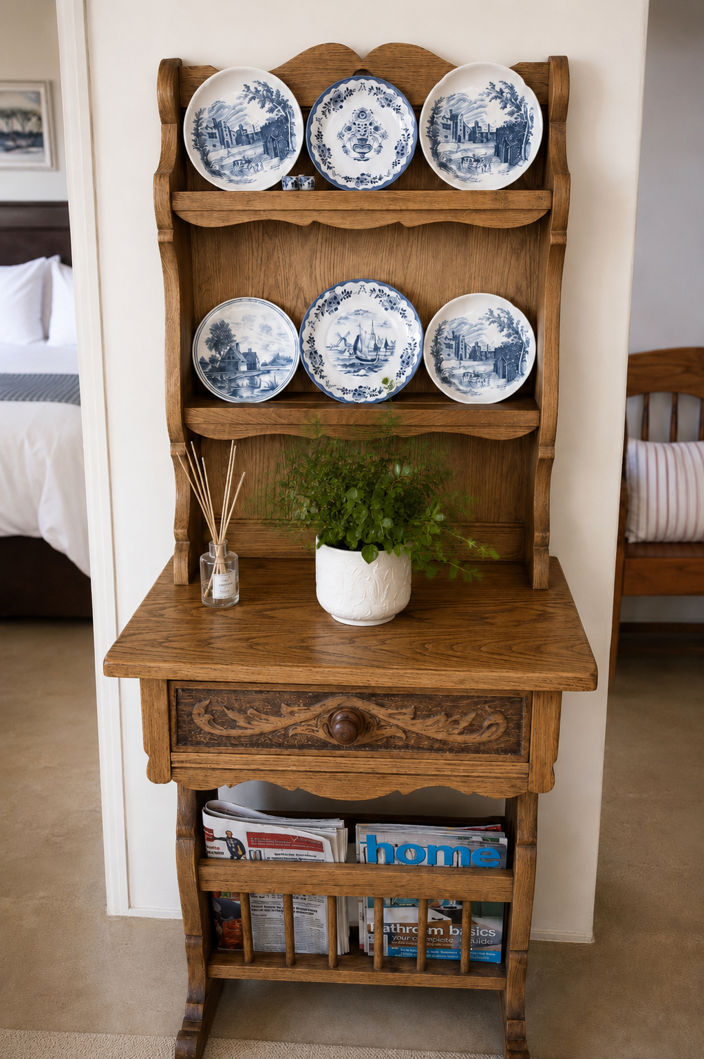 Oak bookcase with blue-and-white plates and magazines